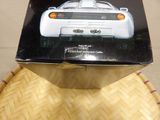 a box with a picture of a white car on it