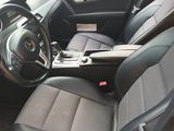 the interior of a car with black leather seats and a steering wheel