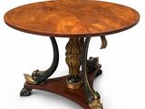 une table à manger ronde avec un plateau en bois et des pieds en métal