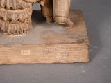 a statue of a man and a woman sitting on a bench