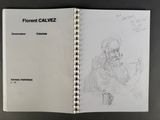 an open book with a drawing of a man sitting in a chair