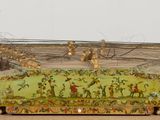 a small wooden box with barbed on top of it