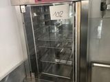 a commercial oven with a glass door in a kitchen