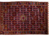 an antique persian rug with a multicolored design and fringe fringes