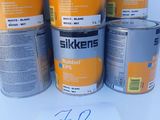 six cans of silkkens rubber epp paint on a white surface