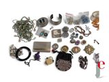 a lot of jewelry that is on the table