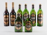 six bottles of whisky are lined up on a white surface
