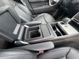 a picture of the inside of a car with a center console