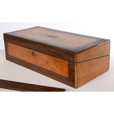 an old wooden box sitting on top of a table next to a pair of scissors