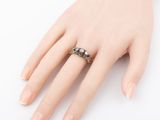 an image of a woman ' s hand with a ring on it ' s finger
