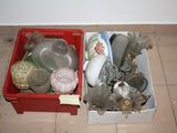 a red box filled with assorted items sitting on the floor