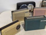 many different types of radio sitting on a table