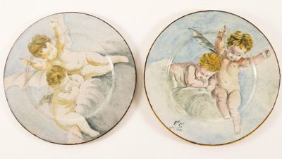 two plates that have angels on them on them