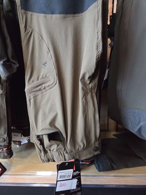clothing on display in a store for sale on a shelf