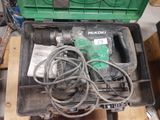 a green box with tools in it sitting on a pallet