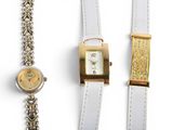 three different types of watches and bracelets on a white surface