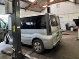 a white van that is parked in a garage