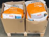 two boxes of seeding supplies sitting on a pallet
