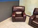 two recliners that are sitting in the corner of a room