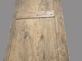 an old wooden door on a gray surface with a gray background