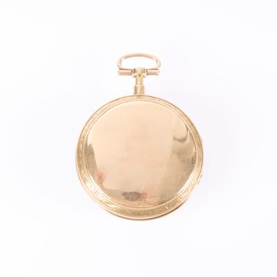 pocket watch on a white surface with a white background