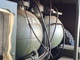 many tanks that are lined up in the back of a truck
