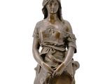 bronze statue of a woman holding a pot and sitting on a stool