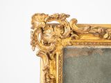a picture of a gold frame with a picture on it