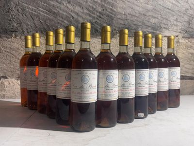 six bottles of wine are lined up in a row on a table