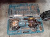 a blue tool box with a drill and other tools in it