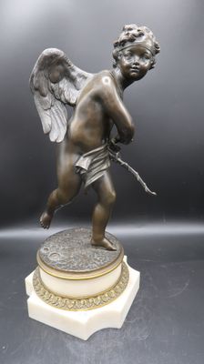 an image of a statue of a cupid holding a bow and arrow