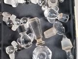 a black box with a bunch of glass objects in it
