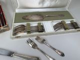 a box with silverware and a set of forks and spoons