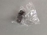 a piece of chocolate in a plastic bag on a table
