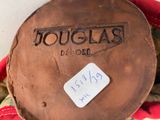a close up of a brown shoe with a tag on it