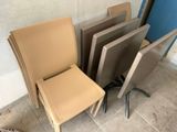 a stack of chairs sitting next to each other on the floor