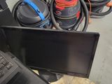 a laptop computer sitting on top of a pile of trash