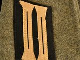 a close up of a military uniform with the letter iii on it