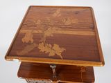 a wooden table with a floral design on it
