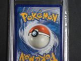 a close up of a pokemon card in a plastic case
