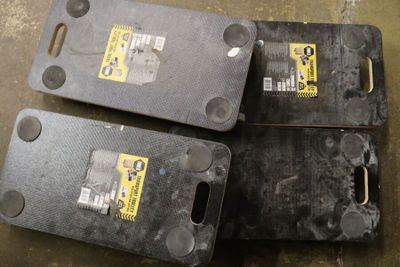 three pieces of plastic that are sitting on the floor
