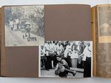 an open book with a picture of a woman and a group of people