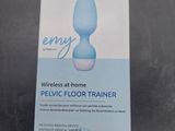 an empty box of a blue vibrating floor trainer on a table