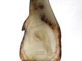 a picture of a piece of marble with a face on it