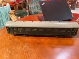 a laptop sitting on top of a train car on a table