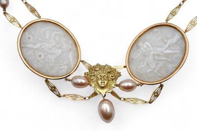 an image of a necklace with a face and pearls on it