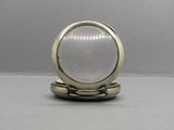 a ring with a white stone in it on a table