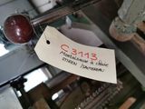 a label on a machine that has a red apple on it