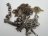 a close up of a bunch of metal items on a white surface