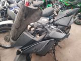 many motorcycles that are parked in a lot together